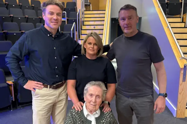 Thomas Niblock and Oisin McConville with Sean Brown's wife Bridie and daughter Clare
