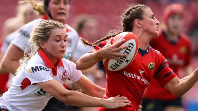 Rachael McIlroy tackles Emily Lane during the Munster v Ulster match in Cork