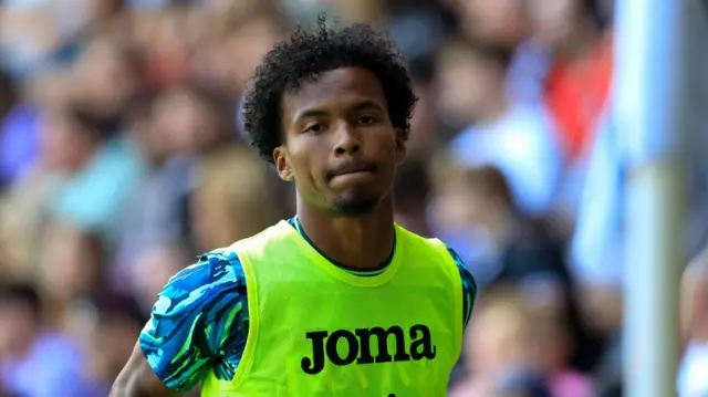 Ruben Providence warms up during the friendly against Rio Ave