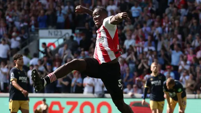 Michael Kayode celebrates