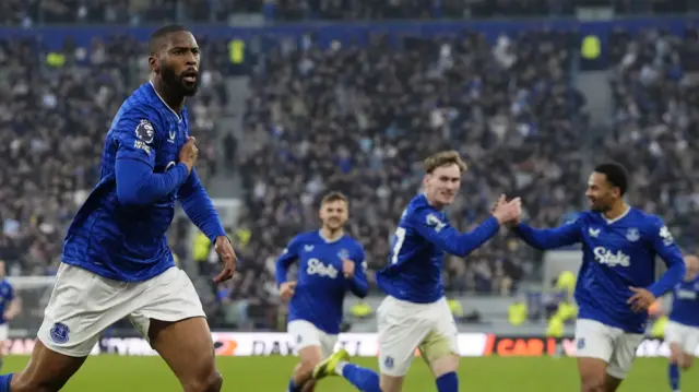 Everton players celebrate a goal