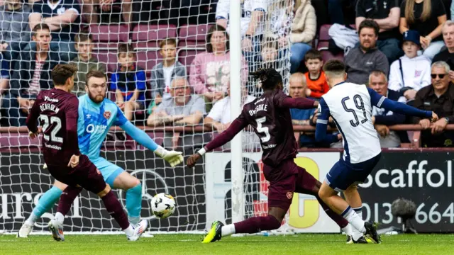 Tottenham Hotspur's Mikey Moore scores