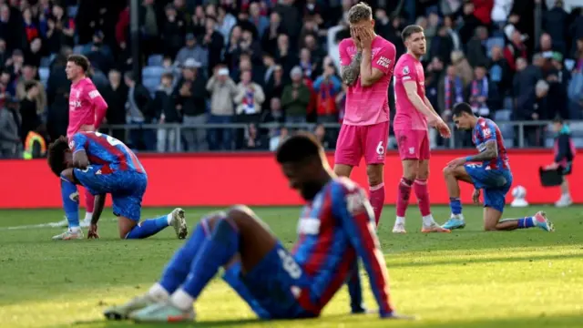 Luke Woolfenden holds his head in his hands