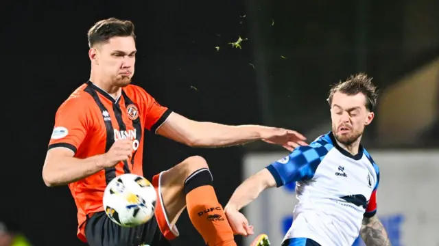 Dundee United's Iurie Iovu and Falkirk's Brad Spencer