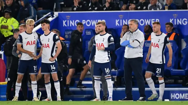 Tottenham manager Ange Postecoglou on the touchline with players Lucas Bergvall, Archie Gray, Timo Werner and Dejan Kulusevski