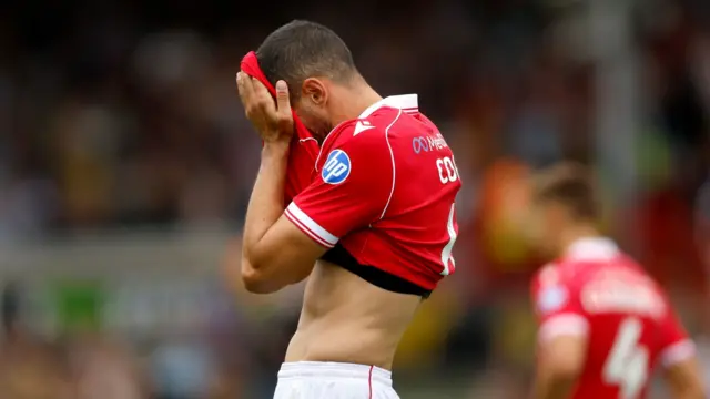 Wrexham's Connor Coady covers his face with his shirt after the final whistle of a 3-2 home defeat against West Bromwich Albion