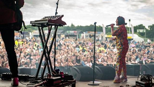 Mae Stephens on stage performing