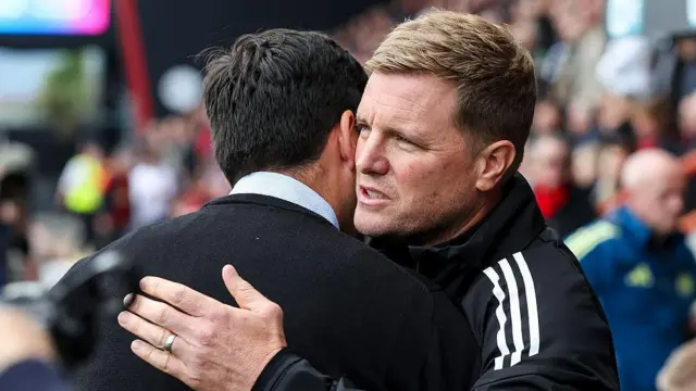 Andoni Iraola and Eddie Howe hug