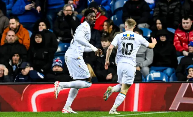 Dundee's Amadou Bakayoko and Lyall Cameron