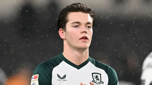 Sverre Nypan claps the Middlesbrough fans at the end of an away match as the rain pours down