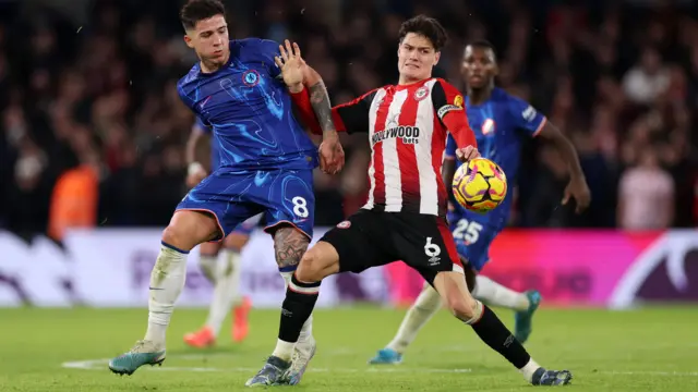 Enzo Fernandez of Chelsea battles for possession with Christian Norgaard of Brentford during the Premier League match between Chelsea FC and Brentford FC at Stamford Bridge