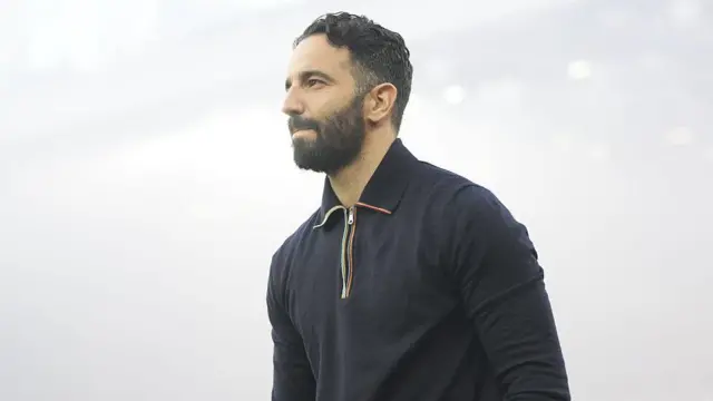 Ruben Amorim looks on under lights in stadium