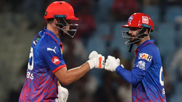 Delhi Capitals' Sameer Rizvi and Tristan Stubbs punch gloves