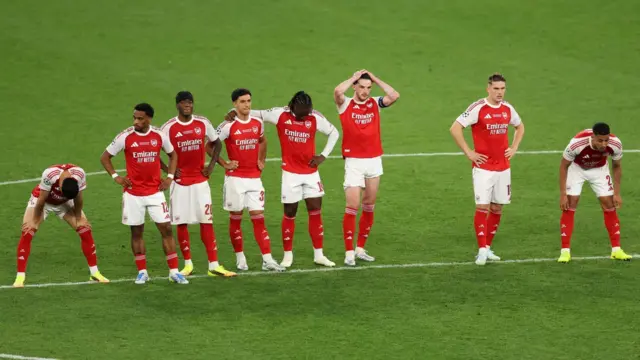 Arsenal players look dejected
