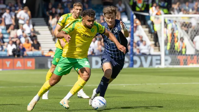 Millwall's Jensen Metcalfe and Norwich City's Anis Ben Slimane battling for the ball during their Championship match on Saturday