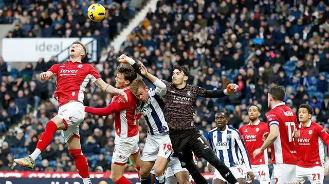 Bristol City goalkeeper Max O'Leary punching away the ball during their Boxing Day game at West Brom