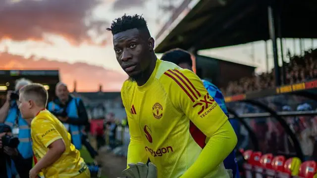 Andre Onana of Manchester United walks out before the Carabao Cup tie against Grimsby Town at Blundell Park