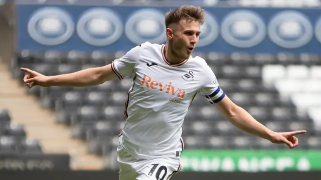 Ben Lloyd celebrates scoring a goal for Swansea City Under-21s