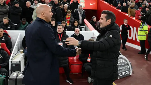 Arne Slot, Manager of Liverpool, embraces Marco Silva, Manager of Fulham, prior to the Premier League match between Liverpool FC and Fulham FC at Anfield