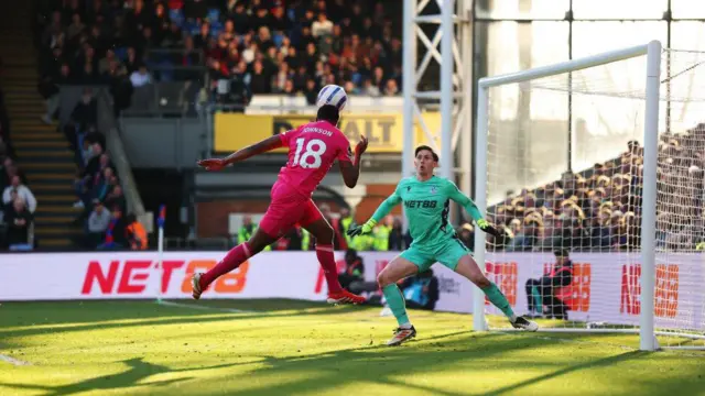 Ben Johnson heads at goal for Ipswich