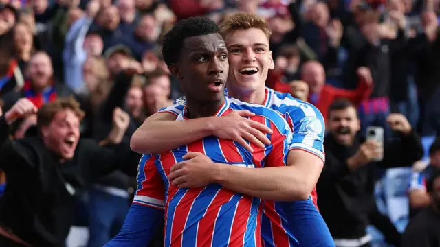 Eddie Nketiah celebrates scoring his team's second goal with teammate Justin Devenny