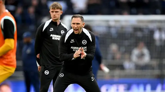 Andrew Crofts encouraging Brighton players during a warm-up before a game