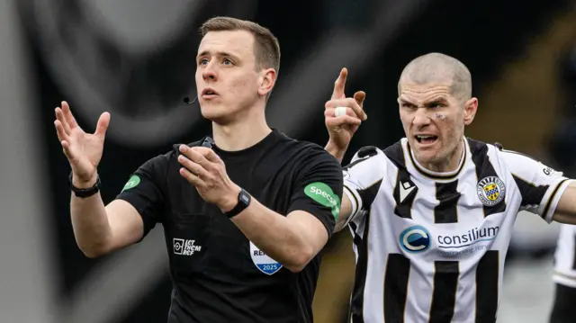 Alex Gogic points a finger at referee Ross Hardie