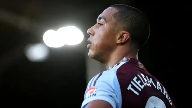 Youri Tielemans looks on under the lights