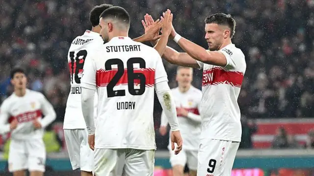 Stuttgart's Ermedin Demirovic (right) celebrates scoring against Koln