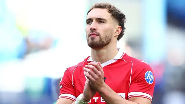 Wrexham striker Sam Smith applauds