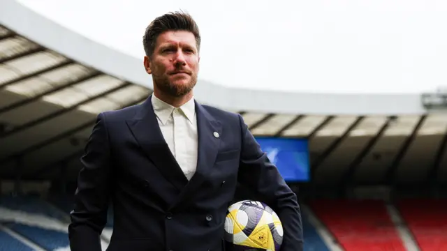 Sebastian Pocognoli poses for photos at Hampden