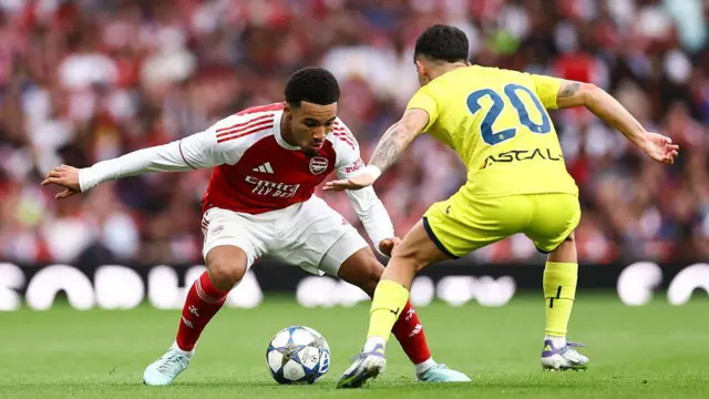  Ethan Nwaneri of Arsenal takes on Alberto Moleiro of Villarreal during the pre-season friendly