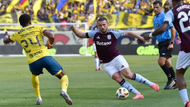 Villa's John McGinn runs with the ball