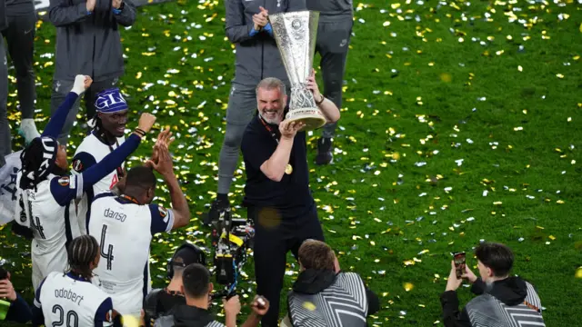Ange Postecoglou lifts the Europa League trophy