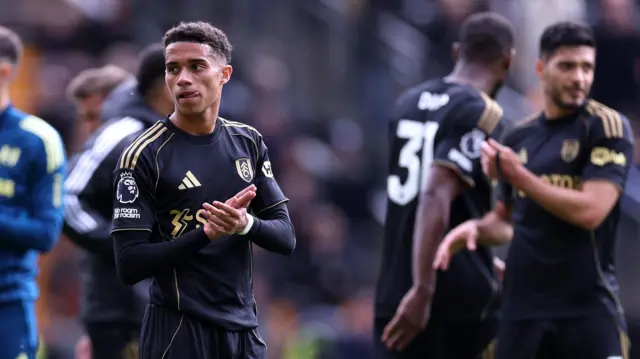 Fulham's Josh King applauds away fans