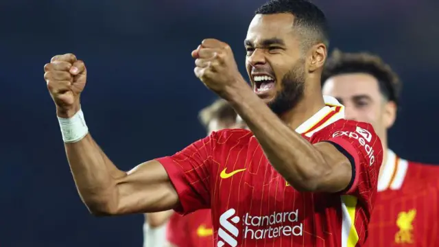 Cody Gakpo of Liverpool celebrates scoring their first goal against Brighton