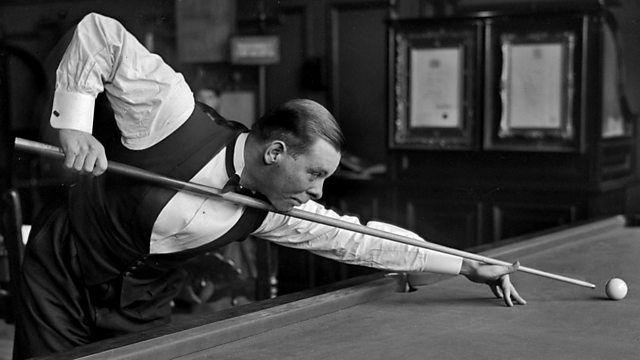 Archive photo of Joe David with short dark hair hitting a white ball with a cue