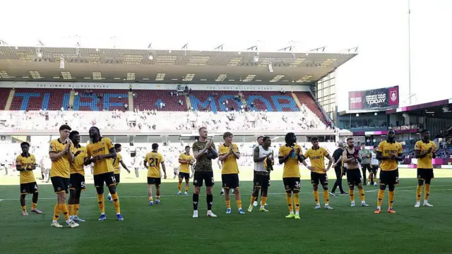 Players of Wolverhampton Wanderers applaud the fans
