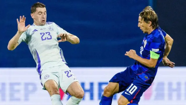 Kenny McLean and Luka Modric