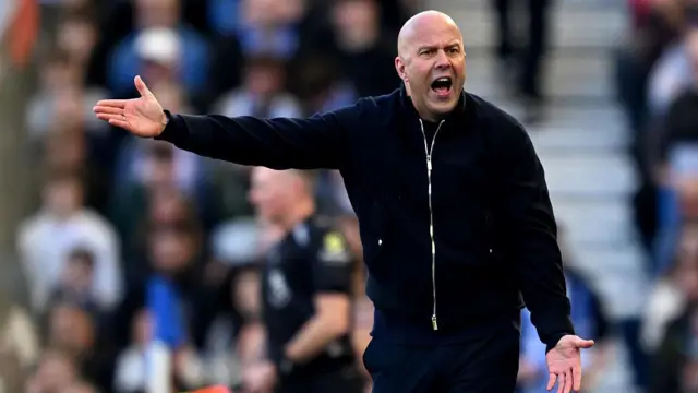 Arne Slot reacts on the sidelines