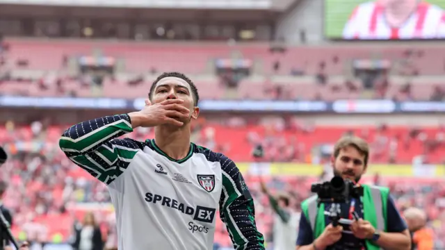 Jobe Bellingham celebrates in front of fans