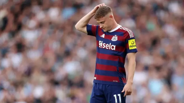 Harvey Barnes scratches his head