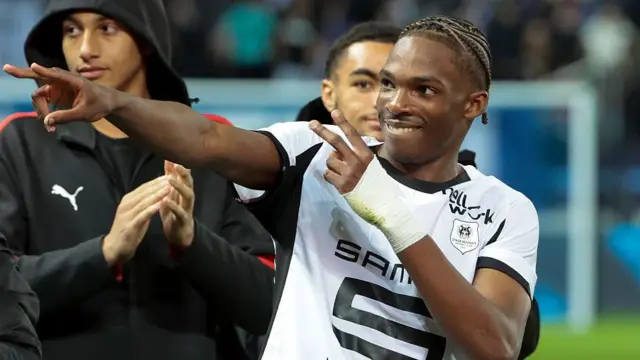 Jeremy Jacquet of Rennes and team-mates celebrate the victory over Paris FC