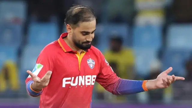 Dubai Capitals spinner Waqar Salamkheil celebrates taking a wicket