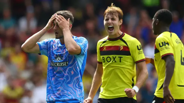 Watford's Hector Kyprianou celebrates as Southampton's Taylor Harwood-Bellis raises his hands to his head in the Hornets opening day win in the Championship