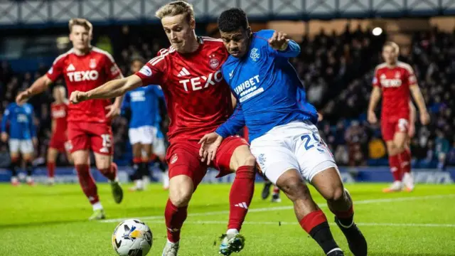 Rangers' Hamza Igamane (R) and Aberdeen's Jeppe Okkels in action during a William Hill Premiership match between Rangers and Aberdeen at Ibrox Stadium, 