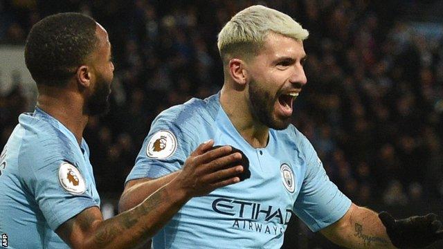 Sergio Aguero (right) celebrates with team-mate Raheem Sterling after scoring for Manchester City against Arsenal