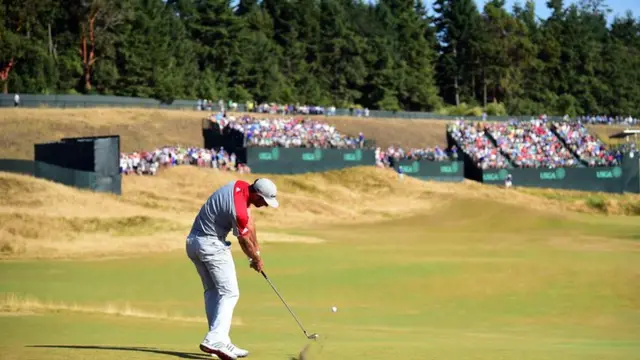 Dustin Johnson plays a shot on the fairway