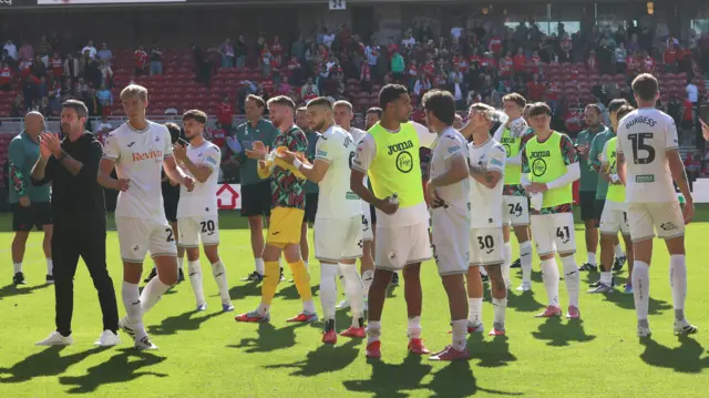 Swansea players and staff after defeat at Middlesbrough 