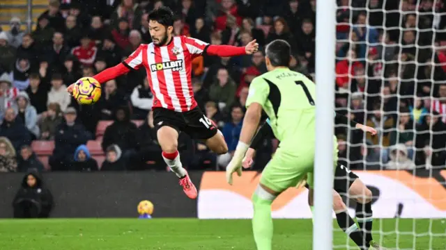 Southampton's Japanese defender #16 Yukinari Sugawara (L) touches the ball with the hand